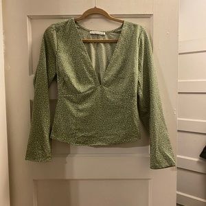 Light green v neck blouse with white detailing